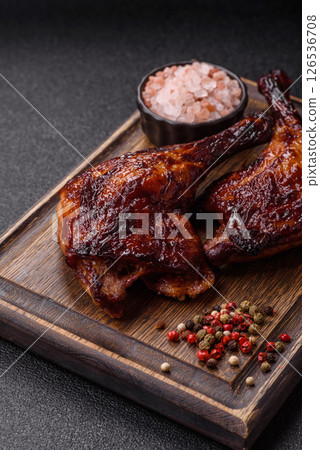 Duck, chicken leg or thigh grilled on a dark concrete background Duck, chicken leg or thigh grilled on a dark concrete background 126536708