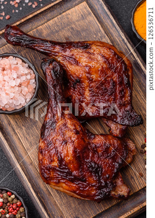 Duck, chicken leg or thigh grilled on a dark concrete background Duck, chicken leg or thigh grilled on a dark concrete background 126536711