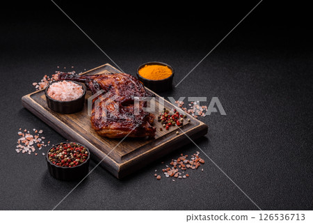 Duck, chicken leg or thigh grilled on a dark concrete background Duck, chicken leg or thigh grilled on a dark concrete background 126536713