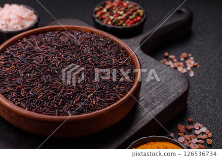 Red or brown raw rice in a ceramic bowl Red or brown raw rice in a ceramic bowl 126536734