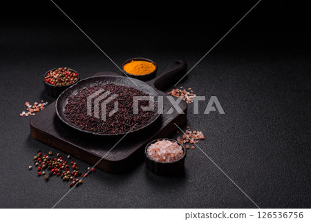 Red or brown raw rice in a ceramic bowl Red or brown raw rice in a ceramic bowl 126536756