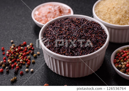 Red or brown raw rice in a ceramic bowl Red or brown raw rice in a ceramic bowl 126536764