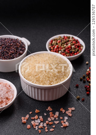 White raw rice in a ceramic bowl. Rice as an ingredient 126536787