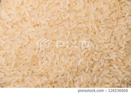 White raw rice in a ceramic bowl. Rice as an ingredient White raw rice in a ceramic bowl. Rice as an ingredient 126536808