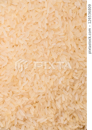 White raw rice in a ceramic bowl. Rice as an ingredient 126536809