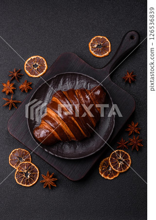 Sweet fresh crispy croissant with chocolate filling Sweet fresh crispy croissant with chocolate filling 126536839