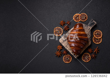Sweet fresh crispy croissant with chocolate filling Sweet fresh crispy croissant with chocolate filling 126536842