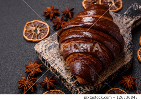 Sweet fresh crispy croissant with chocolate filling 126536845