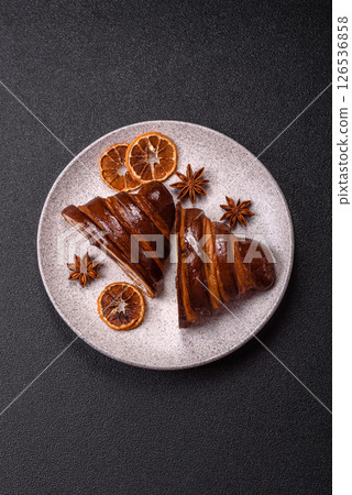 Sweet fresh crispy croissant with chocolate filling 126536858