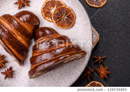Sweet fresh crispy croissant with chocolate filling 126536865