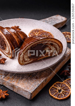 Sweet fresh crispy croissant with chocolate filling Sweet fresh crispy croissant with chocolate filling 126536867