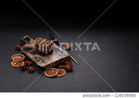 Sweet round tart with chocolate coating and nut filling Sweet round tart with chocolate coating and nut filling 126536900