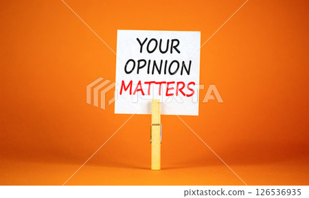 Your opinion matters symbol. Concept words Your opinion matters on beautiful white paper on clothespin. Beautiful orange background. Business your opinion matters concept. Copy space. Your opinion matters symbol. Concept words Your opinion matters on beautiful white paper on clothespin. Beautiful orange background. Business your opinion matters concept. Copy space. 126536935