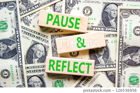 Pause and reflect symbol. Concept words Pause and reflect on beautiful block. Dollar bills. Beautiful background from dollar bills. Business motivational lifestyle pause and reflect concept Copy space Pause and reflect symbol. Concept words Pause and reflect on beautiful block. Dollar bills. Beautiful background from dollar bills. Business motivational lifestyle pause and reflect concept Copy space 126536956