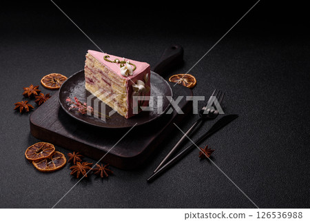 A piece of pink layered cake with strawberry flavor A piece of pink layered cake with strawberry flavor 126536988