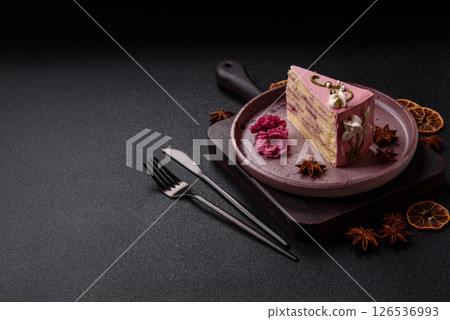 A piece of pink layered cake with strawberry flavor A piece of pink layered cake with strawberry flavor 126536993