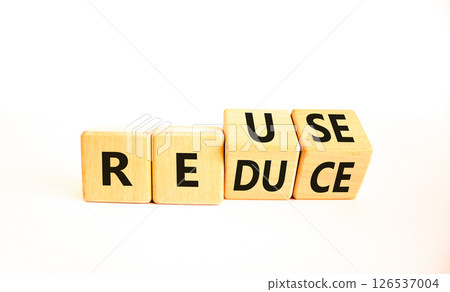 Reuse or reduce symbol. Concept words Reuse Reduce on wooden block. Beautiful white table white background. Business reuse or reduce concept. Copy space. 126537004
