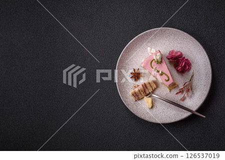 A piece of pink layered cake with strawberry flavor A piece of pink layered cake with strawberry flavor 126537019
