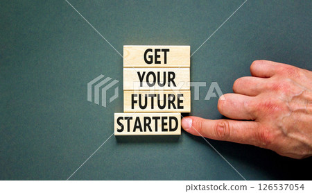 Get your future started symbol. Concept words Get your future started on beautiful wooden blocks. Beautiful grey background. Businessman hand. Business get your future started concept. Copy space. 126537054