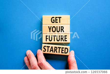Get your future started symbol. Concept words Get your future started on beautiful wooden blocks. Businessman hand. Beautiful blue background. Business get your future started concept. Copy space. 126537066
