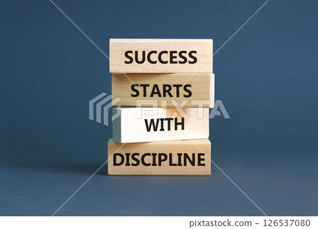 Success starts with discipline symbol. Concept words Success starts with discipline on beautiful wooden blocks. Beautiful grey background. Business success starts with discipline concept. Copy space 126537080