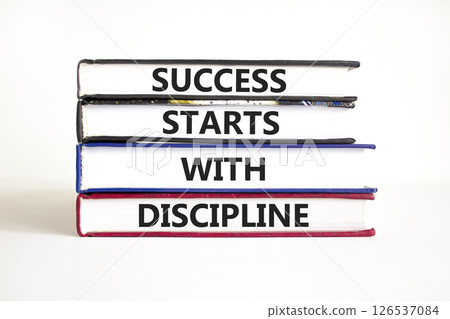 Success starts with discipline symbol. Concept words Success starts with discipline on beautiful books. Beautiful white background. Business and success starts with discipline concept. Copy space. 126537084