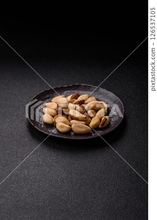 Brazil nut kernels in ceramic bowl 126537105