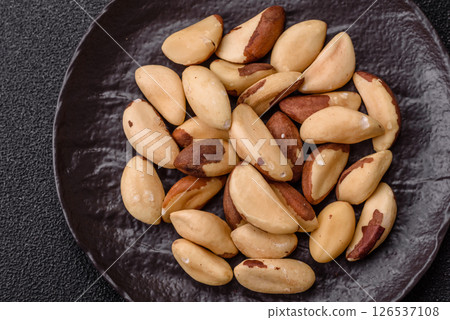 Brazil nut kernels in ceramic bowl 126537108