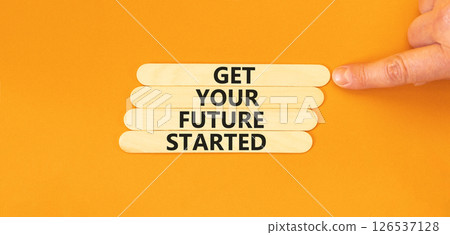 Get your future started symbol. Concept words Get your future started on beautiful wooden sticks. Beautiful orange table orange background. Business get your future started concept. Copy space. 126537128