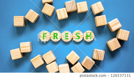 Fresh symbol. Concept word Fresh on beautiful wooden circles. Beautiful blue table blue background. Beautiful wooden cubes. Business lifestyle fresh concept. Copy space. 126537131