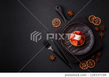 Round sweet tart with strawberry pieces and cream Round sweet tart with strawberry pieces and cream 126537194