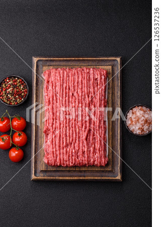 Raw ground beef or pork with salt and spices Raw ground beef or pork with salt and spices 126537236