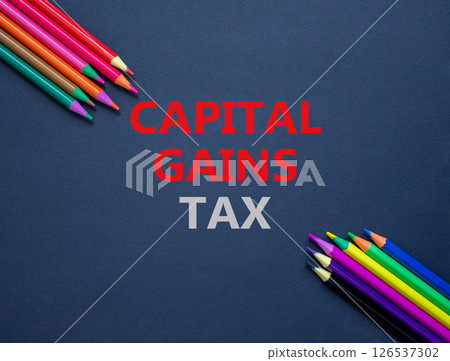 Capital gains tax symbol. Concept words Capital gains tax on beautiful black paper. Colored pencils. Beautiful black background. Business and capital gains tax concept. Copy space. Capital gains tax symbol. Concept words Capital gains tax on beautiful black paper. Colored pencils. Beautiful black background. Business and capital gains tax concept. Copy space. 126537302