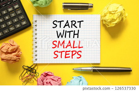 Start with small steps symbol. Concept words phrase Start with small steps on beautiful white note. Colored paper. Beautiful yellow background. Business Start with small steps concept. Copy space Start with small steps symbol. Concept words phrase Start with small steps on beautiful white note. Colored paper. Beautiful yellow background. Business Start with small steps concept. Copy space 126537330