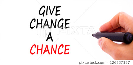 Give change a chance symbol. Concept words phrase Give change a chance on beautiful white paper. Businessman's hand. Beautiful white background. Business Give change a chance concept. Copy space. 126537337