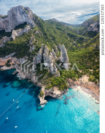 Aerial view of rocks and mountains, blue bay, beach, boats Aerial view of rocks and mountains, blue bay, beach, boats 126537365