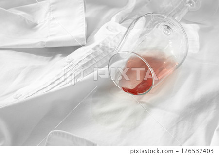 Glass, with pink wine, spilled on a white shirt, close-up, selective focus, no people, concept, top view, Glass, with pink wine, spilled on a white shirt, close-up, selective focus, no people, concept, top view, 126537403