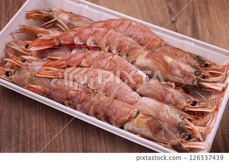 Fresh frozen Argentine shrimp, laid out in a container, top view, no people, 126537439
