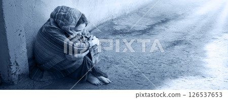 Frozen girl sitting on the floor 126537653