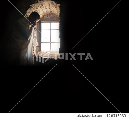 Ancient man at the old wondow Ancient man at the old wondow 126537683