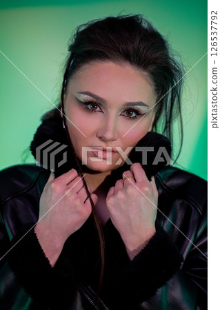 Stylish and captivating portrait featuring modern makeup and a fashionable outfit that impresses Stylish and captivating portrait featuring modern makeup and a fashionable outfit that impresses 126537792