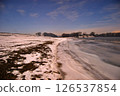 Frozen riverbank under moonlight 126537854