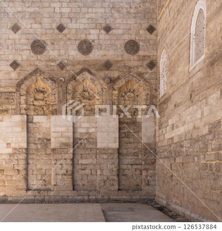 Explore historic architecture at the Mosque of al-Zahir Baybars in Cairo, Egypt during golden hour shadows Explore historic architecture at the Mosque of al-Zahir Baybars in Cairo, Egypt during golden hour shadows 126537884