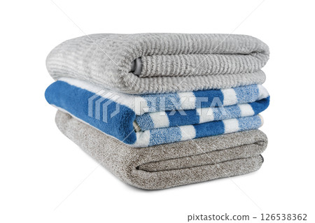 Soft fluffy striped grey and blue bath towels folded in stack isolated on white background 126538362