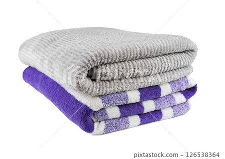 Soft fluffy striped grey and purple bath towels folded in stack isolated on white background 126538364