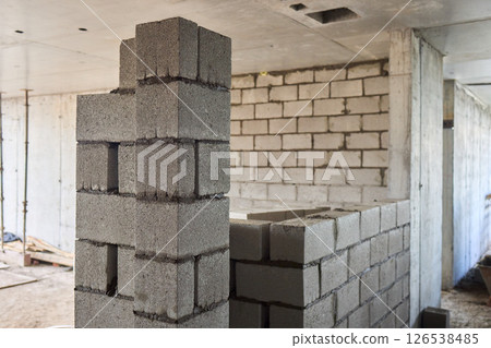 Bricklayer Hard at Work Ongoing Construction of a Residential Building Structure Bricklayer Hard at Work Ongoing Construction of a Residential Building Structure 126538485