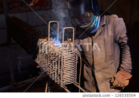 Welding Sparks Are Flying High as Metalwork Beautifully Takes Shape in the Workshop Welding Sparks Are Flying High as Metalwork Beautifully Takes Shape in the Workshop 126538504