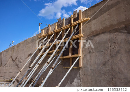A construction scene showcasing the intricate framework and robust supports in place A construction scene showcasing the intricate framework and robust supports in place 126538512