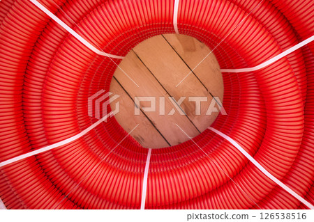 Coiled Red Hose with Connector Ideal for Various Applications Across Multiple Industries Coiled Red Hose with Connector Ideal for Various Applications Across Multiple Industries 126538516
