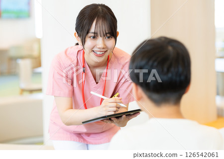 Medical personnel with tablet 126542061